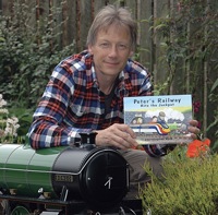 chris-with-books-and-bongo.jpeg